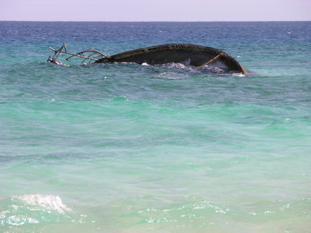 sunken boat in the atlantic ocean in green cape