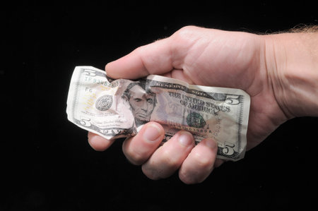 Very Crumpled Banknotes Money over a Black Background
