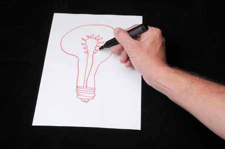 A Caucasian Male Hand Drawing on a White Paperの写真素材