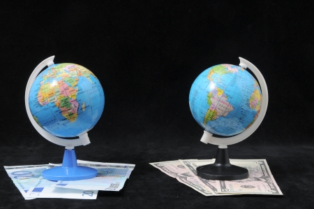 Round Globe and Money on a Dark Backgruondの写真素材