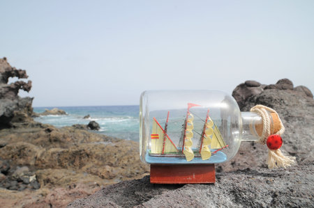 Sailing Ship in the Bottle near the Oceanの写真素材