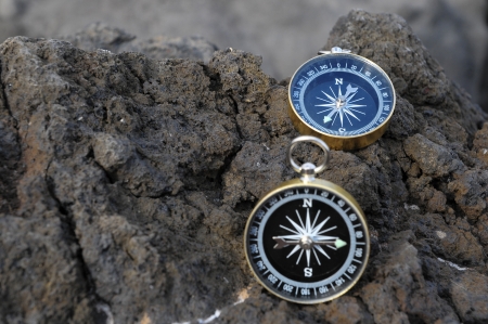 Orientation Concept - Analogic Compass Abandoned on the Rocksの写真素材