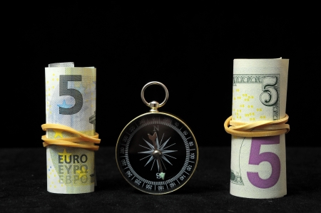 Orientation in  Business Compass and Money on a Black Backgroundの写真素材