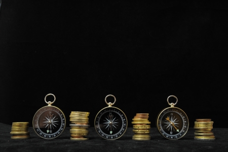 Orientation in  Business Compass and Money on a Black Backgroundの写真素材