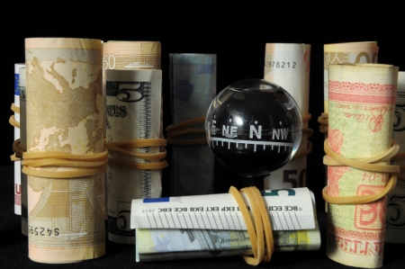 Orientation in  Business Compass and Money on a Black Backgroundの写真素材