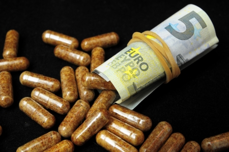 Some Pills And Money on a Black Backgroundの写真素材