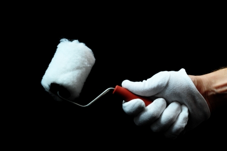 Roll Brush And an Hand on a Black Backgroundの写真素材