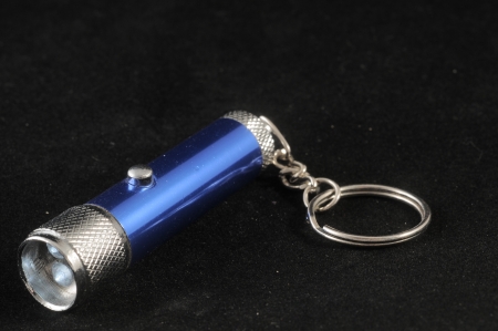 One Blue Aluminum Led Torch on a Black Backgroundの写真素材
