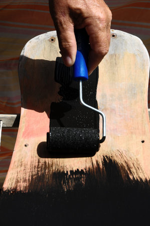 Restore an Old Vintage Skateboard with Black Paintingの写真素材