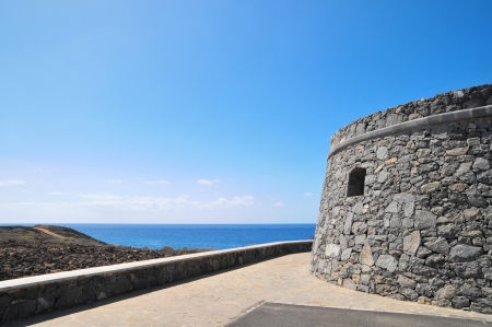 Gray Textured Bunker on a Blue Sky in Spainの写真素材