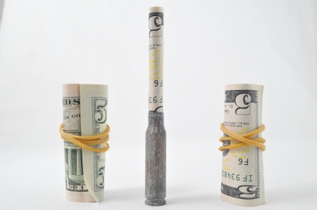 Money and Weapons Concept Bullet and Money on a White の写真素材