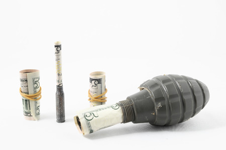 Money and Weapons Concept Weapons and Money on a White の写真素材