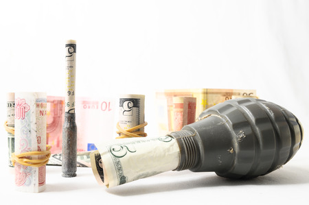 Money and Weapons Concept Weapons and Money on a White の写真素材