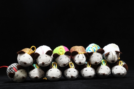 Toy Mouse Made of Cotton Cloth on a Black Backgroundの写真素材
