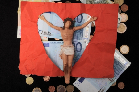 Jesus Christ and Money on a Dark Background - Religion Conceptの写真素材