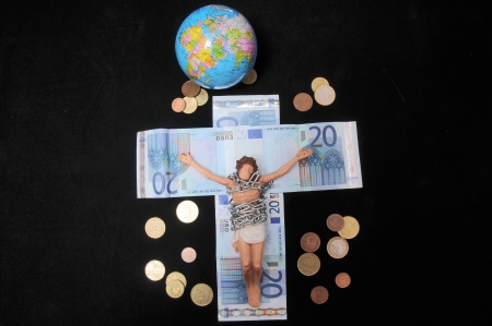 Jesus Christ and Money on a Dark Background - Religion Conceptの写真素材
