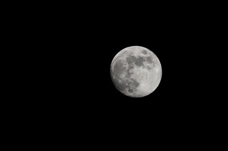 One Full Moon over a Dark Black Skyの写真素材