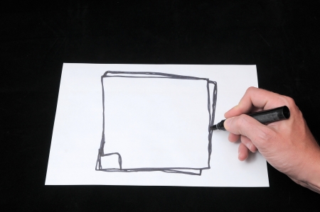 A Caucasian Male Hand Drawing on a White Paperの写真素材