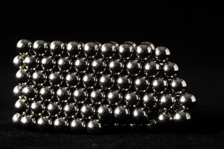 Lot of Round Magnetic Spheres on a Black の写真素材
