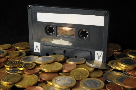 Money and Music Concept Tape Musicassette and Coinsの写真素材