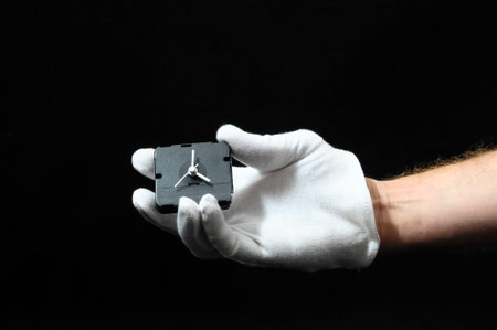 Clock And an Hand on a Black 