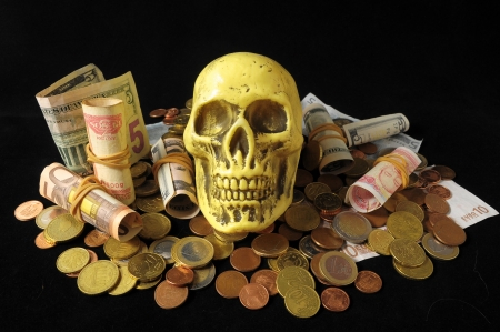 Death and Money Concept Skull and Currency over a Black の写真素材