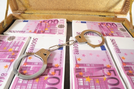One Suitcase Full of Pink 500 Euros Banknotes and Handcuffsの写真素材