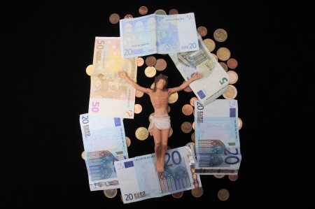 Jesus Christ and Money on a Dark Background - Religion Conceptの写真素材