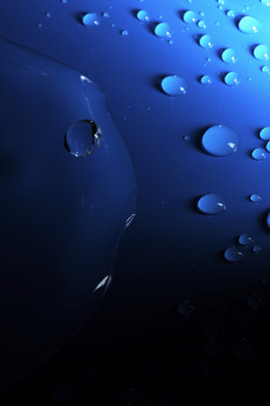 Some Water Drops on a Blue Textured Background