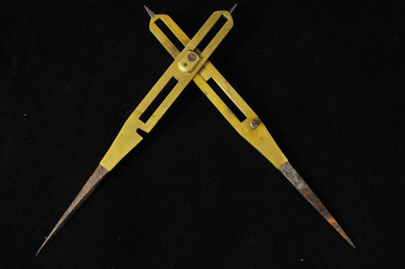 Vintage Angle Measuring Tool on a Black Background
