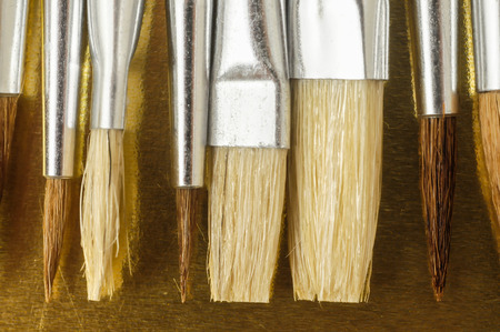 New Wooden Different Paintbrush Set Texture over a Colored Backgroundの写真素材