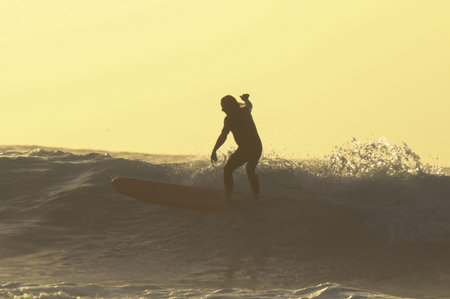 Silhouette Surfer Riding a Big Wave in Tenerife Canary Island Spain