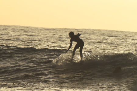 Silhouette Surfer Riding a Big Wave in Tenerife Canary Island Spainの写真素材