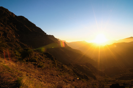 Backlight Silhouette Sunset over the Mountains in Canary Islands Tenerifeの写真素材