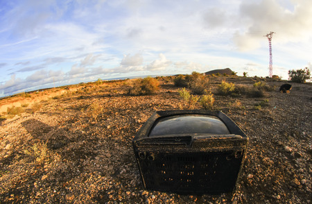 Abandoned Broken Television in the Desert on a Cloudy Dayの写真素材