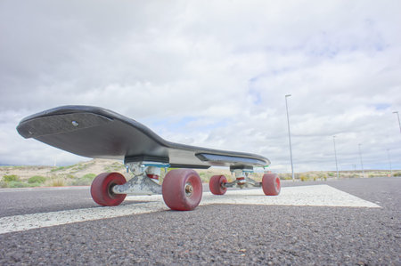 Hdr Picture Vintage Style Longboard Black Skateboard on an Empty Asphalt Desert Road