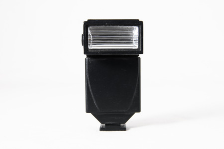 Black Photo Camera Flash on a White の写真素材