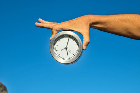 Time Concept White Sand Hourglass on the Volcanic Rocks
