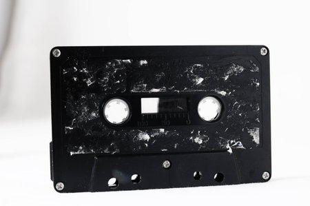 Ancient Vintage Used Musicassette over a White Background