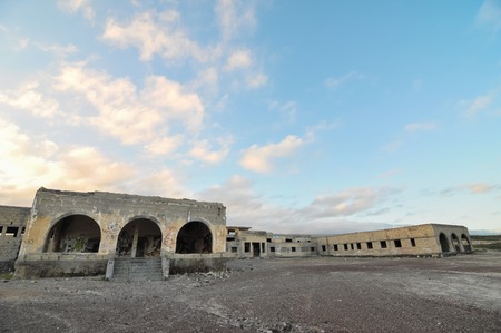 Abandoned Buildings of a Military Base at Sunsetの写真素材