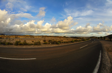 Long Empty Desert Road on a Cludy Dayの写真素材