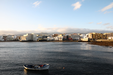 Sea and Building at Sunset in El Medano Tenerife Canary Islandsの写真素材