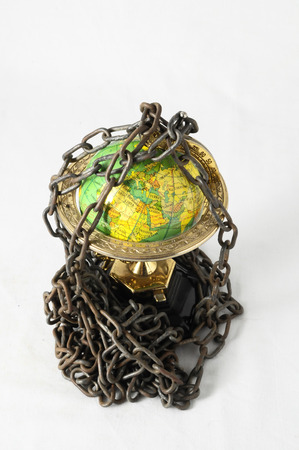 Earth globe close in chain and padlockの写真素材
