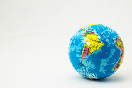 The World Globe Made of Rubber on a White の写真素材