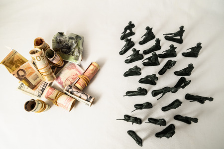 Plastic Lead Soldiers Representing War on a White の写真素材