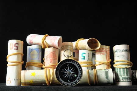 Orientation in Business Compass and Money on a Black Backgroundの写真素材