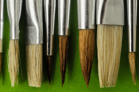New Wooden Different Paintbrush Set Texture over a Colored Background
