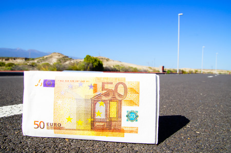 Business Money Concept Banknotes paper  on the Asphalt Streetの写真素材