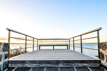 Sunrise on a Pier over Atlantic Ocean in Tenerife Canary Islands Spain