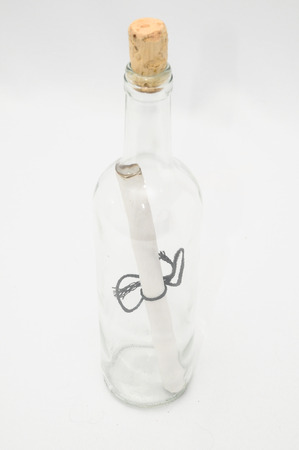 Message in bottle on a whire backgroundの写真素材